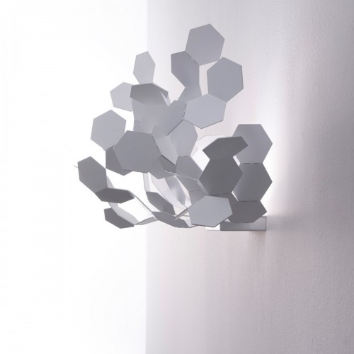 white-colored chandelier hangs on the wall